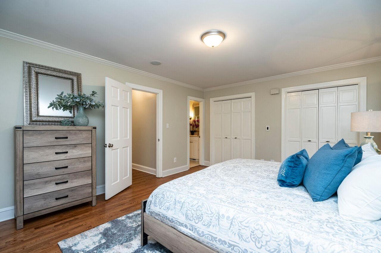 3434 Churchill Road Raleigh, NC 27607 - Photo 14 of 30 a bedroom with a bed and a dresser
