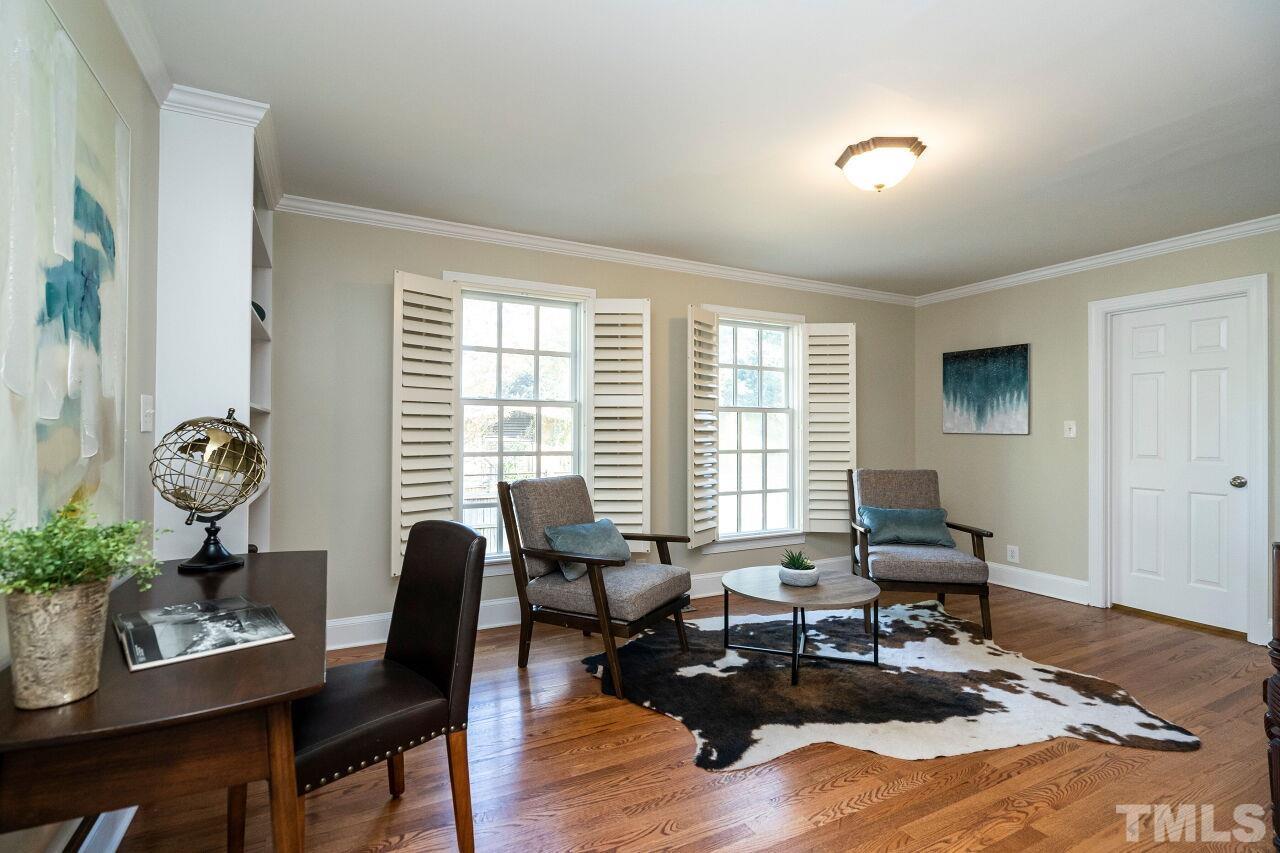 3434 Churchill Road Raleigh, NC 27607 - Photo 16 of 30 a living room with furniture and wooden floor