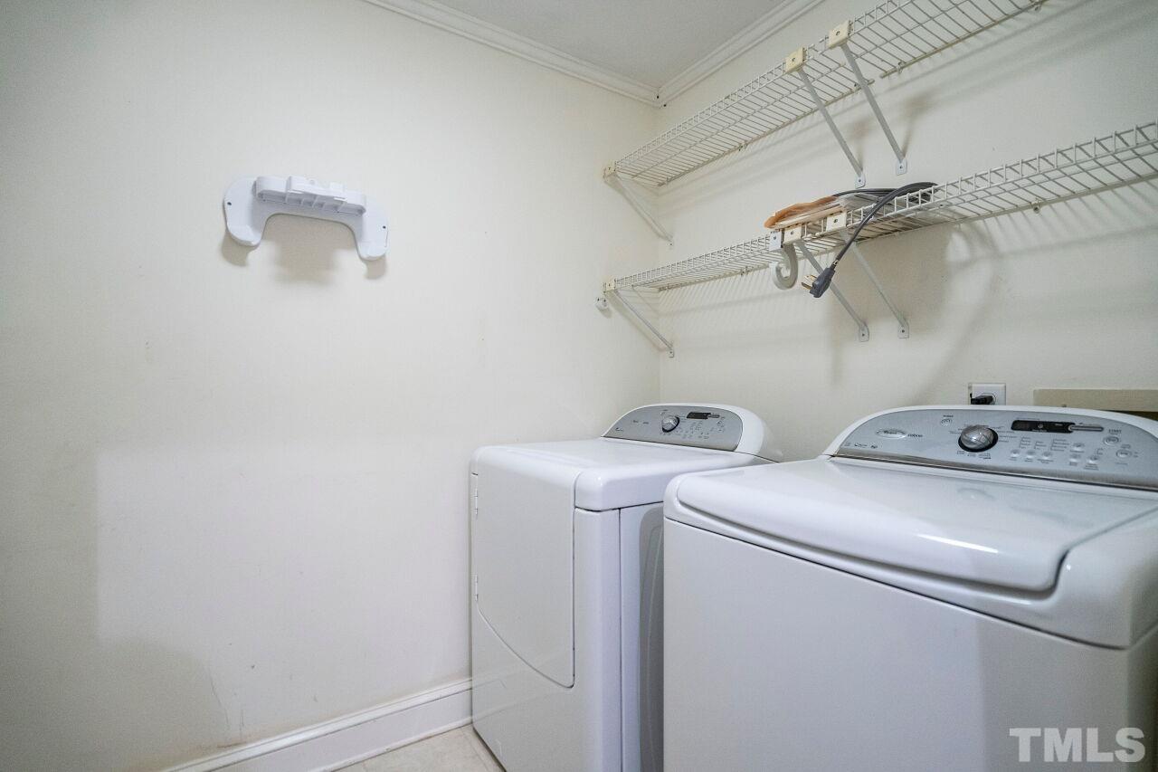 3434 Churchill Road Raleigh, NC 27607 - Photo 18 of 30 a utility room with dryer and washer