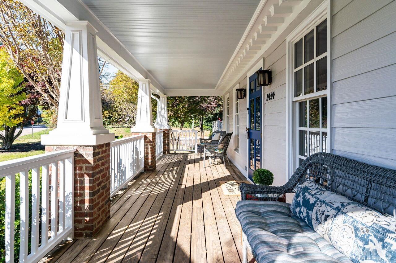 3434 Churchill Road Raleigh, NC 27607 - Photo 3 of 30 a view of balcony with wooden floor and outdoor seating