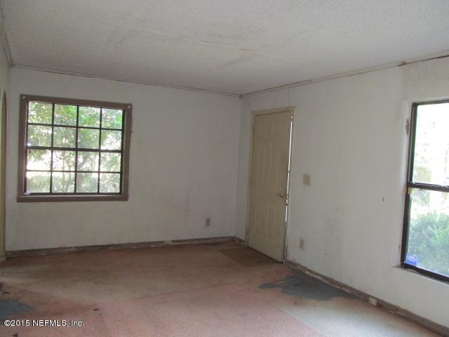 10652 Rutgers Road Jacksonville, FL 32218 - Photo 8 of 14 an empty room with a window