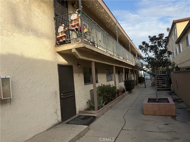 a front view of a house with a sitting area