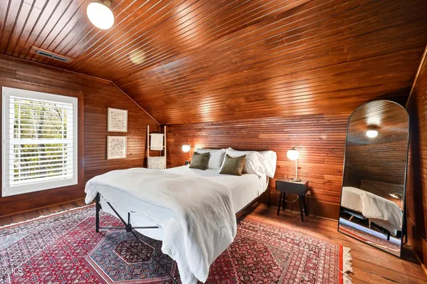 a view of balcony with wooden floor and outdoor seating