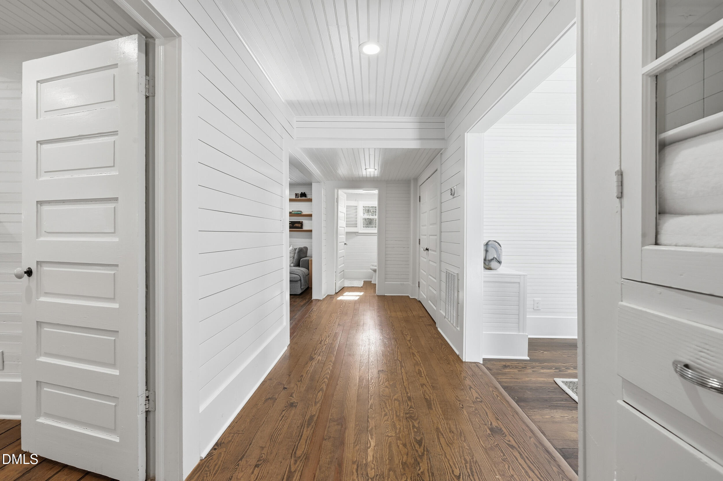 1451 Hawkins Road Hurdle Mills, NC 27541 - Photo 25 of 69 a view of a hallway with wooden floor and closet