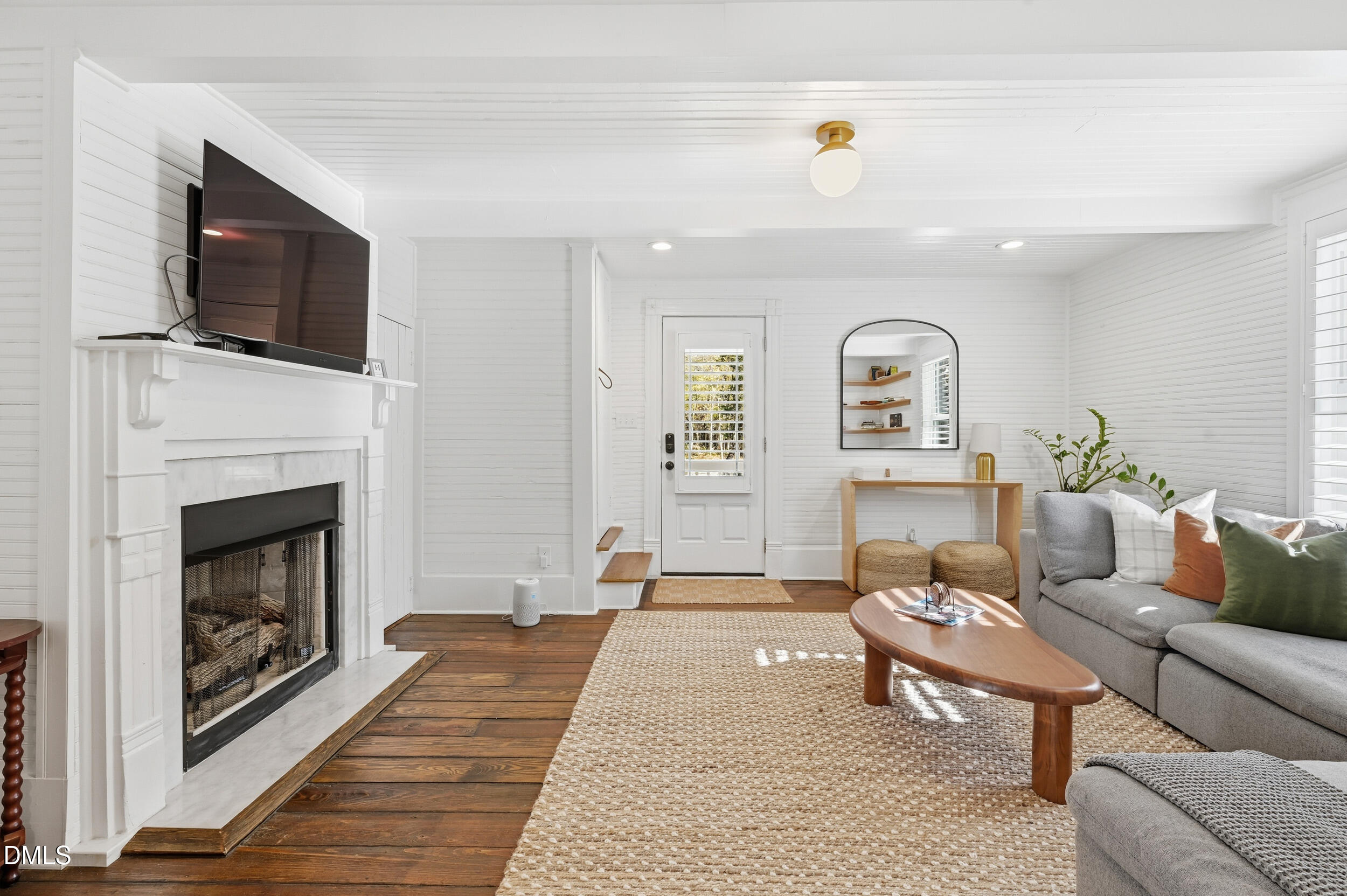 1451 Hawkins Road Hurdle Mills, NC 27541 - Photo 27 of 69 a living room with furniture and a fireplace