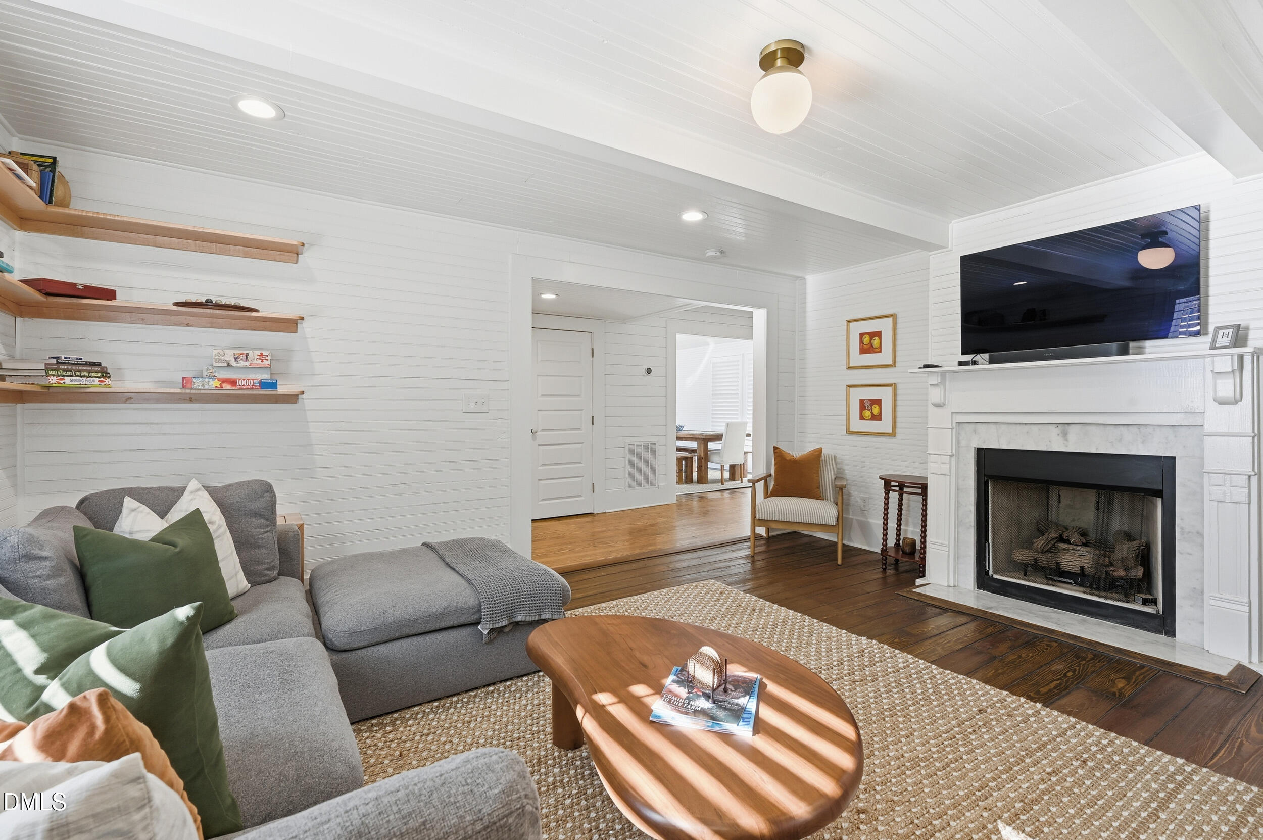 1451 Hawkins Road Hurdle Mills, NC 27541 - Photo 28 of 69 a living room with furniture and a fireplace