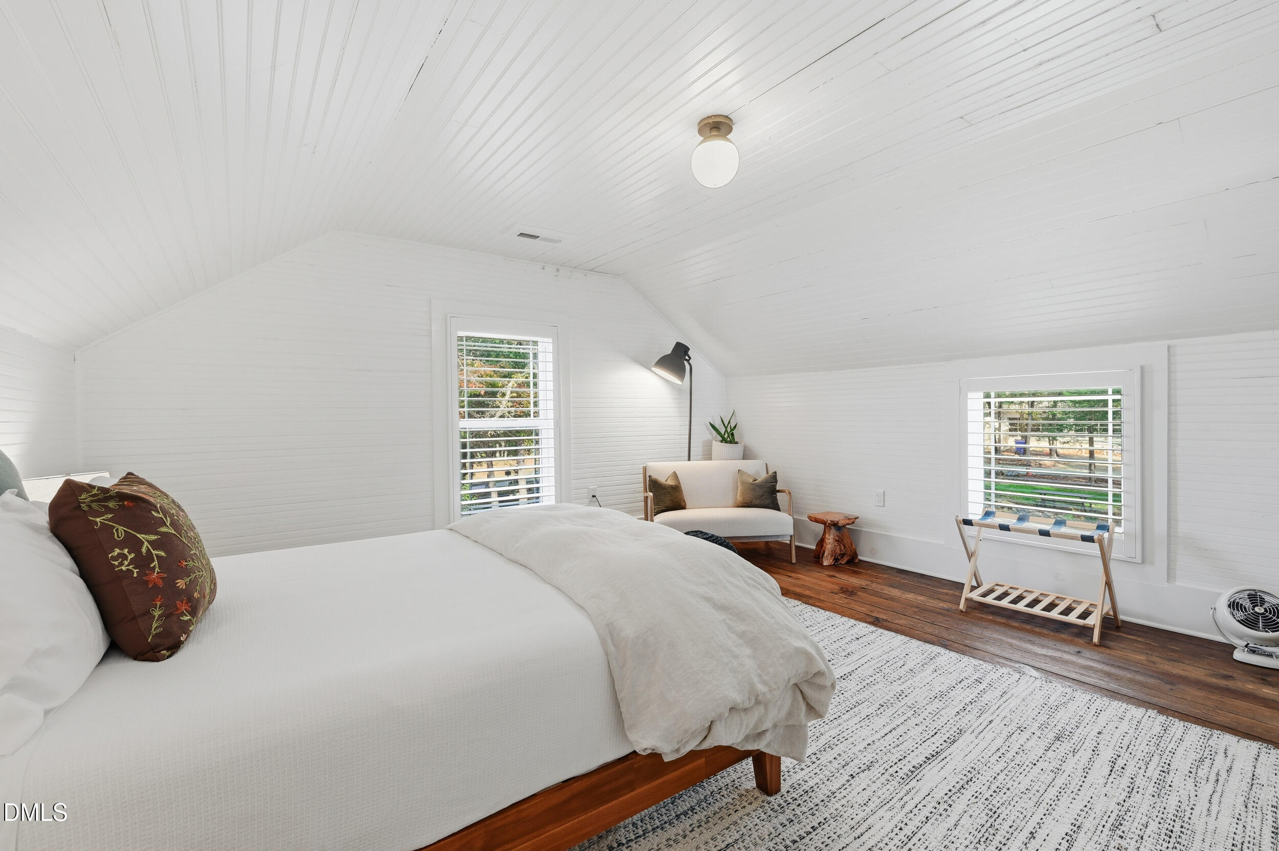 1451 Hawkins Road Hurdle Mills, NC 27541 - Photo 43 of 69 a bedroom with a bed and wooden floor