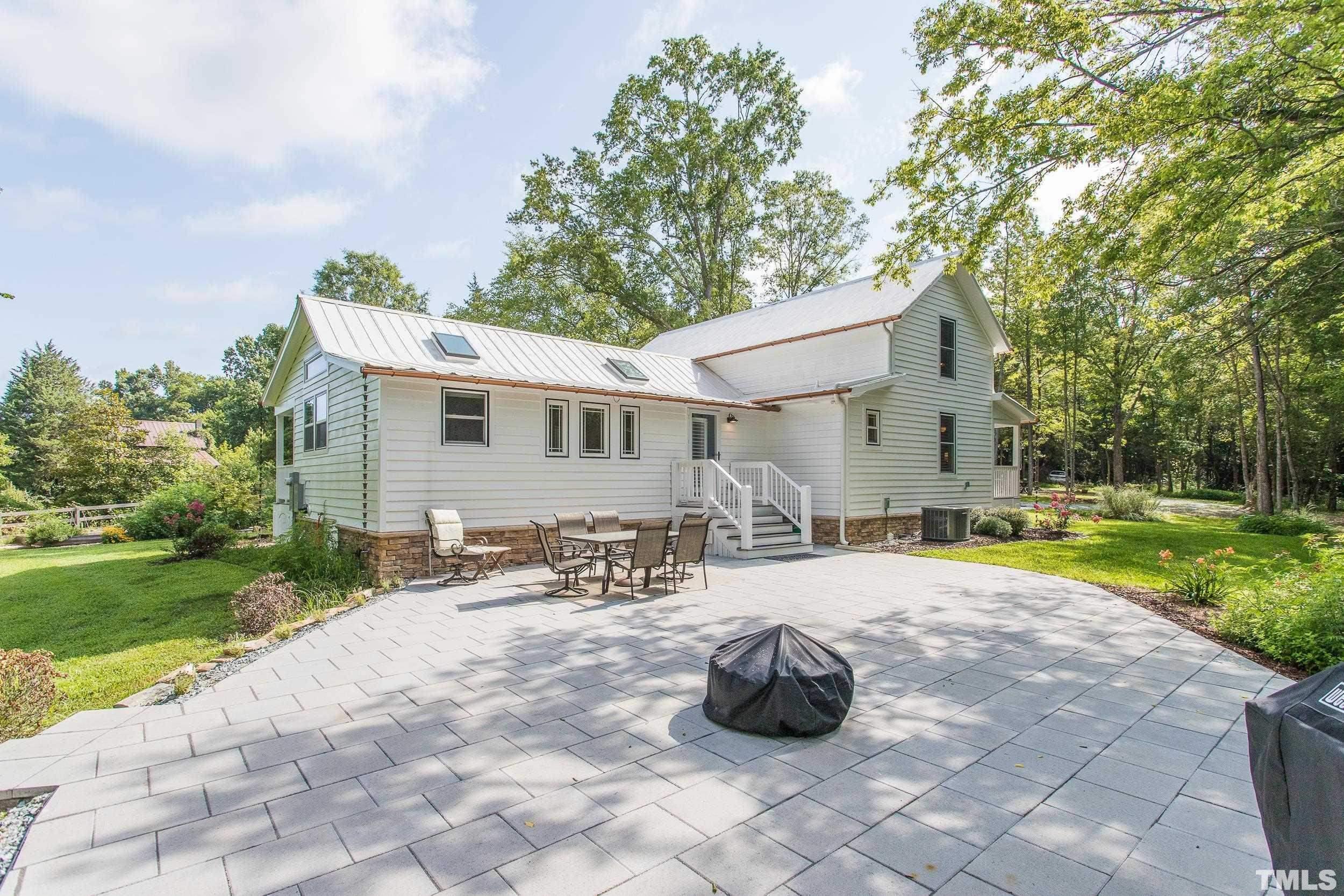 1451 Hawkins Road Hurdle Mills, NC 27541 - Photo 45 of 69 a view of a house with backyard and sitting area