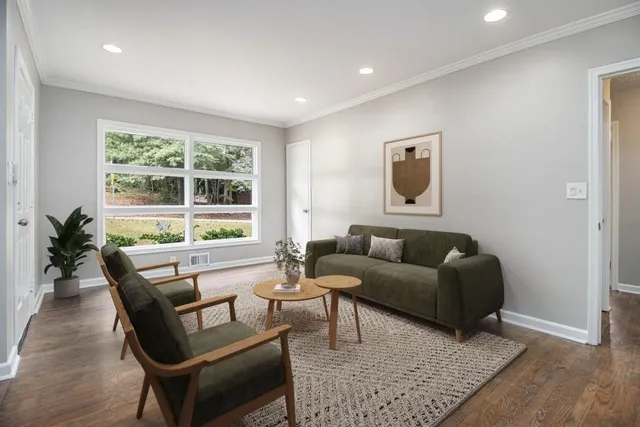 a living room with furniture and a large window