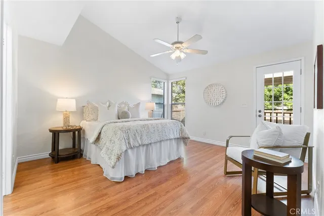 an empty room with windows and ceiling fan