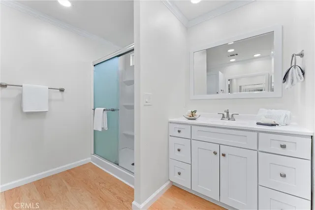 a view of a lake with a bench and trees around