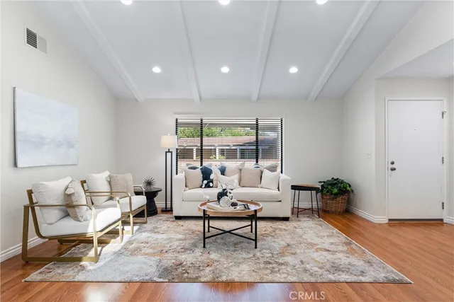 a dining room with furniture and a window