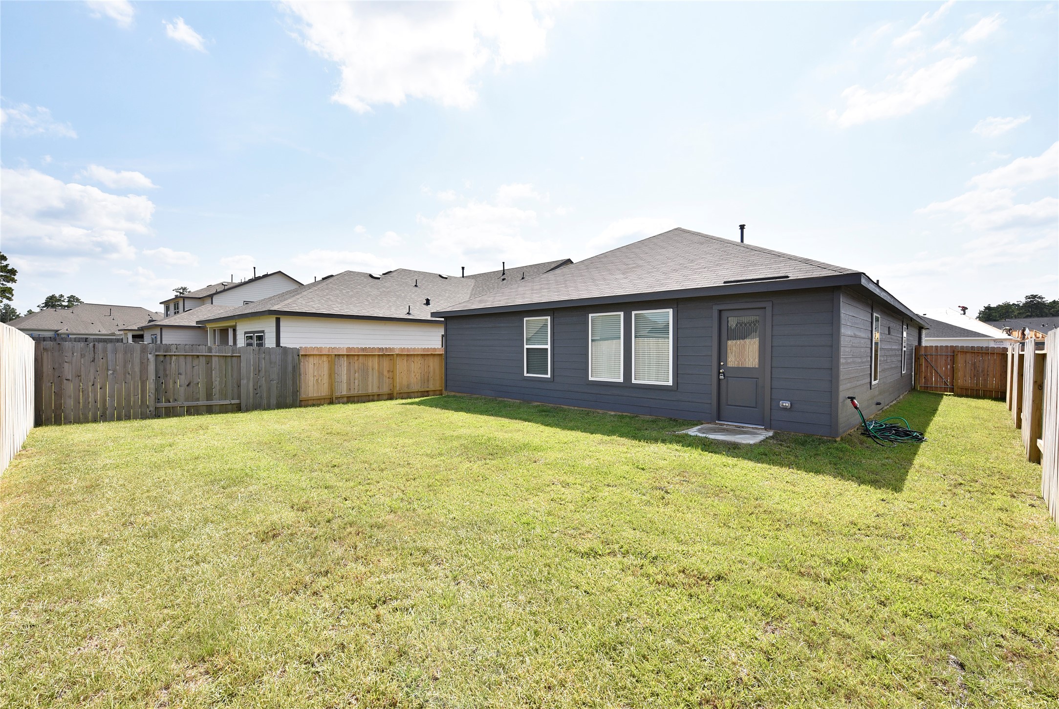 10218 Prairie Dunes Lane Cleveland, TX 77327 - Photo 31 of 32 a house view with a garden space