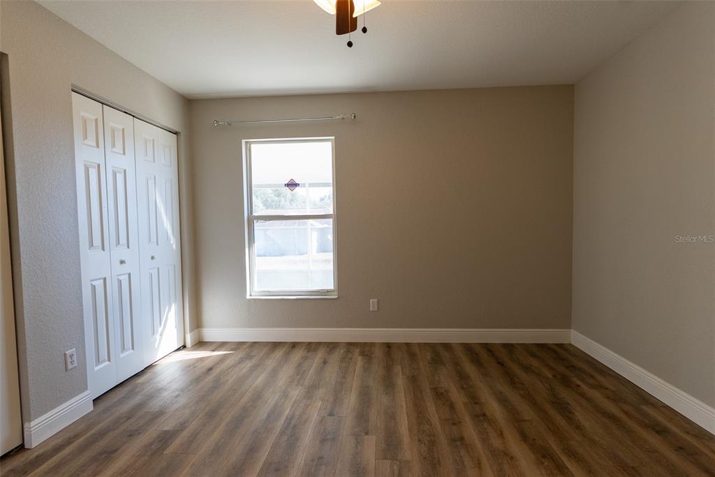 15651 Southwest 19th Terrace Ocala, FL 34473 - Photo 38 of 68 an empty room with wooden floor and windows