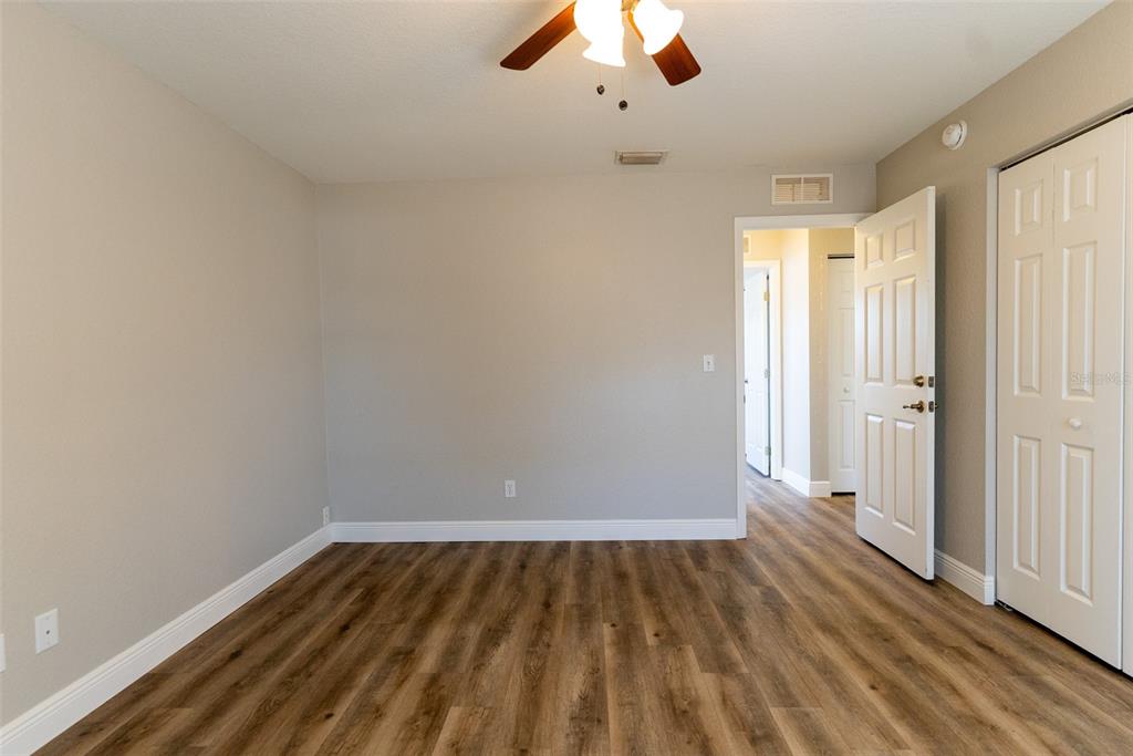 15651 Southwest 19th Terrace Ocala, FL 34473 - Photo 42 of 68 wooden floor in an empty room with a window