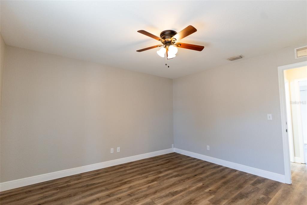 15651 Southwest 19th Terrace Ocala, FL 34473 - Photo 43 of 68 a view of a room with wooden floor and window