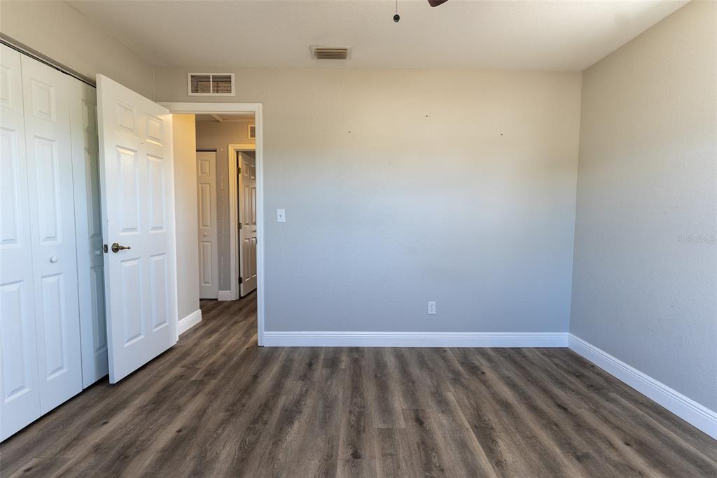 15651 Southwest 19th Terrace Ocala, FL 34473 - Photo 47 of 68 a view of an empty room and wooden floor