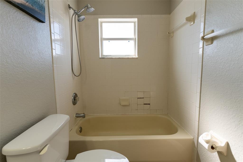 15651 Southwest 19th Terrace Ocala, FL 34473 - Photo 53 of 68 a bathroom with a toilet bathtub and shower