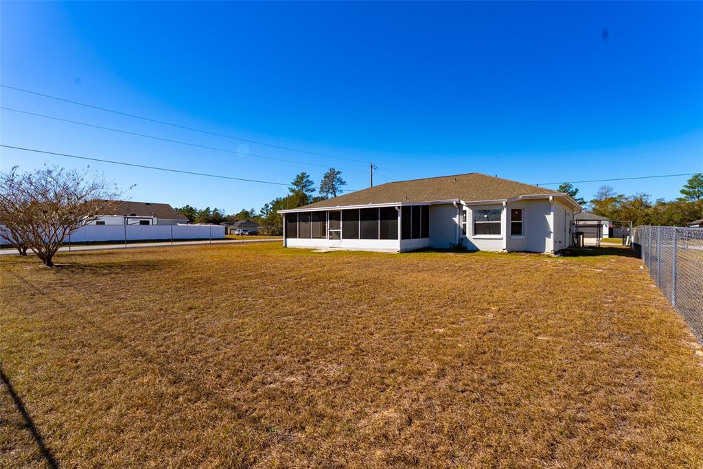 15651 Southwest 19th Terrace Ocala, FL 34473 - Photo 60 of 68 a front view of a house with a garden