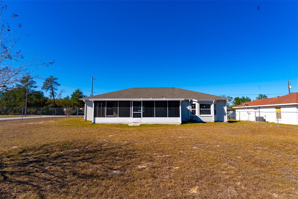 15651 Southwest 19th Terrace Ocala, FL 34473 - Photo 61 of 68 a front view of a house with a yard