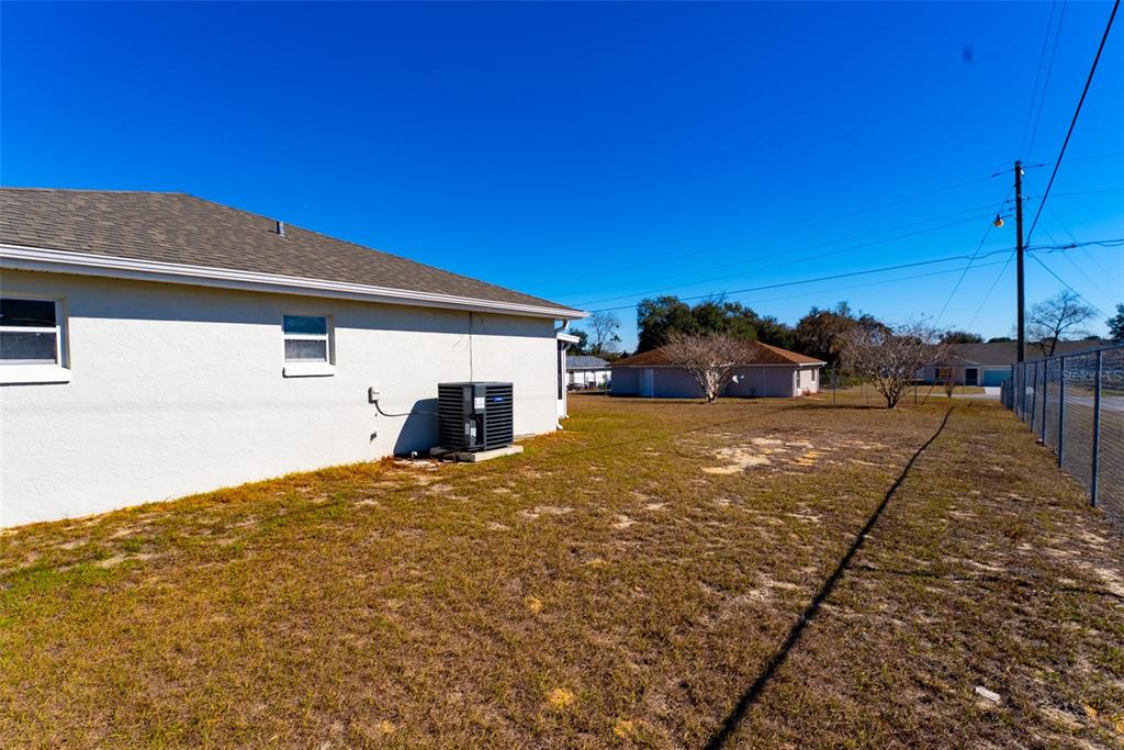 15651 Southwest 19th Terrace Ocala, FL 34473 - Photo 64 of 68 a view of a house with a yard