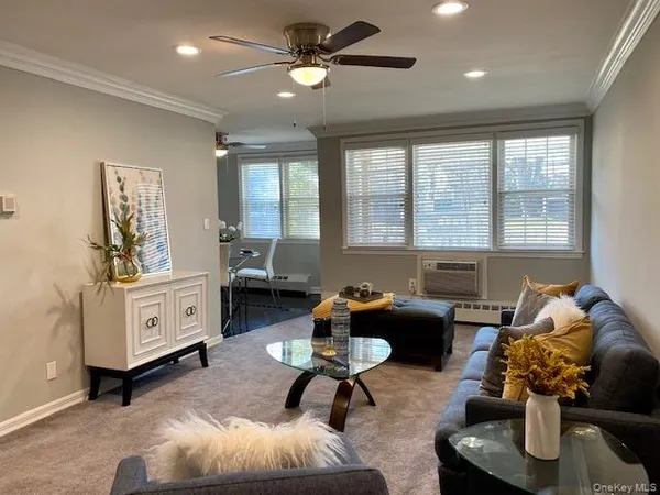 a living room with furniture and a window