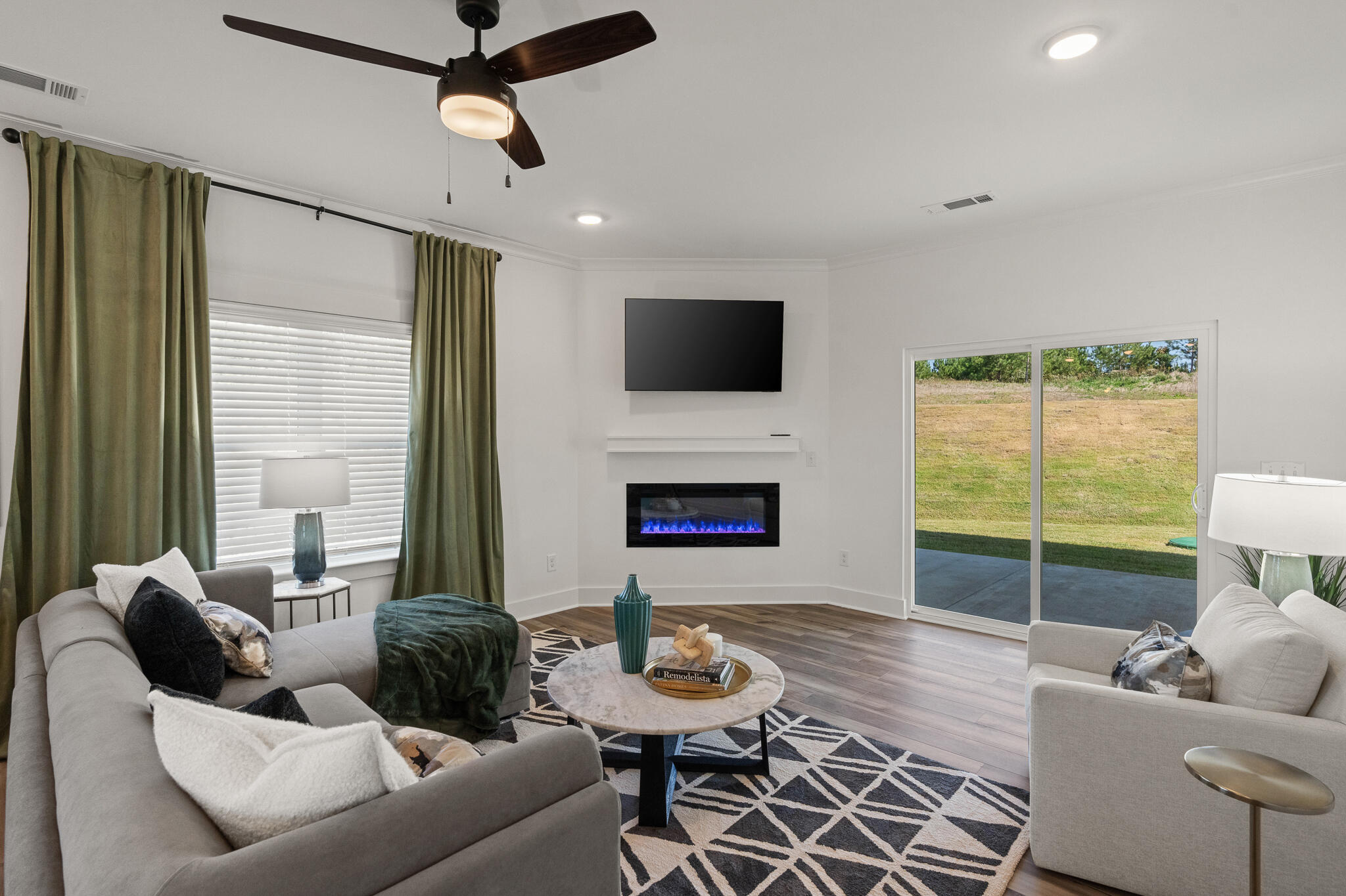 Lot 10 Clarke Hill Road Freeport, FL 32439 - Photo 3 of 52 a living room with furniture a fireplace and a flat screen tv
