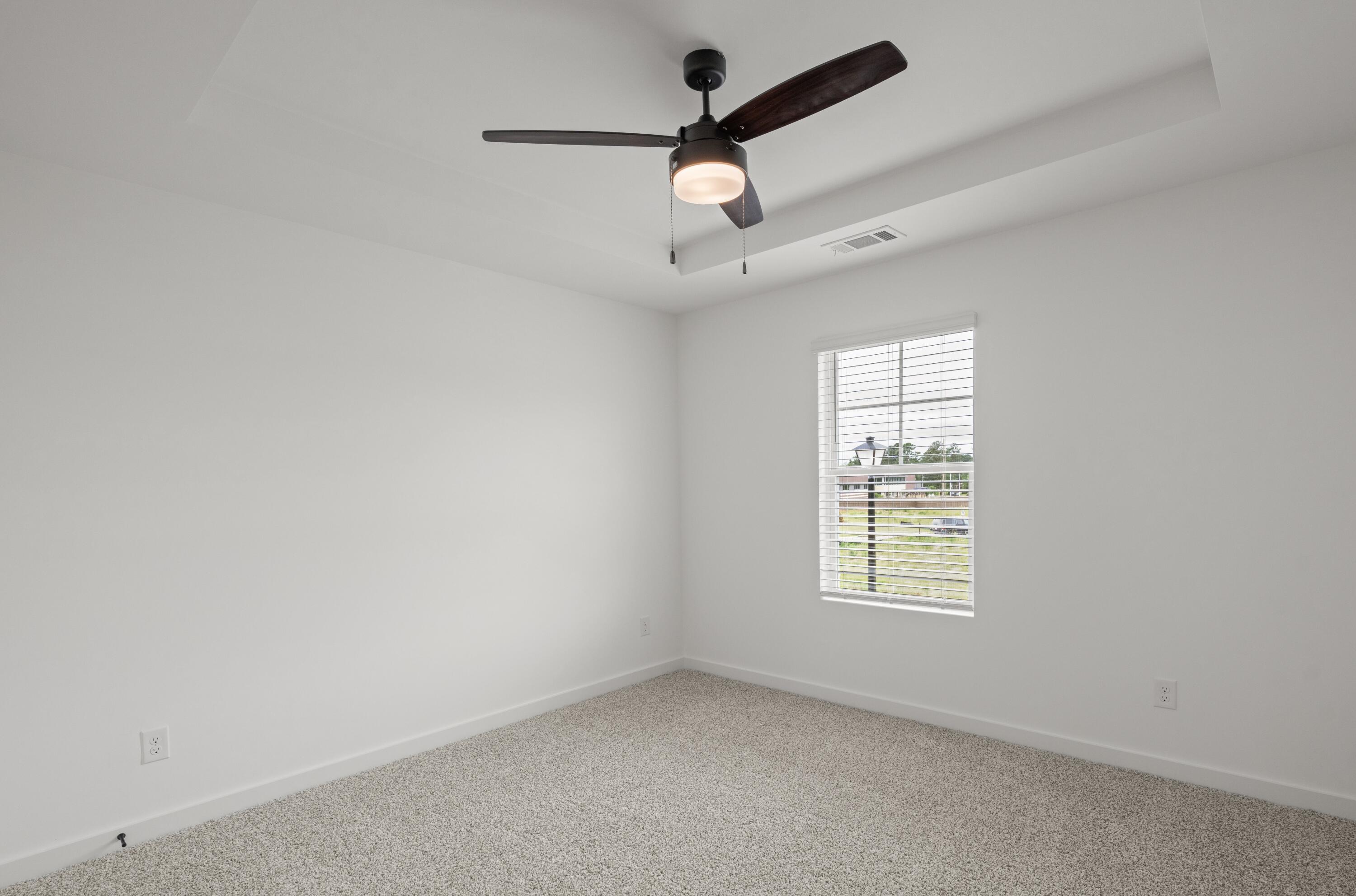 Lot 10 Clarke Hill Road Freeport, FL 32439 - Photo 34 of 52 an empty room with a window and a fan