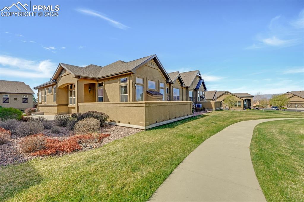 7636 Wichita Ridge Point Colorado Springs, CO 80923 - Photo 30 of 33 Side view of home