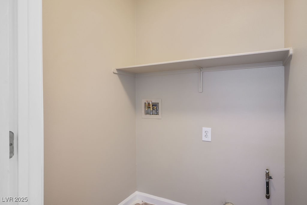 6610 Tumbleweed Ridge Lane, Unit 101 Henderson, NV 89011 - Photo 13 of 24 Laundry area featuring washer hookup and gas dryer hookup