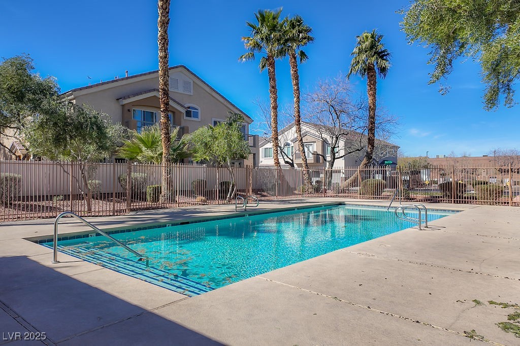 6610 Tumbleweed Ridge Lane, Unit 101 Henderson, NV 89011 - Photo 23 of 24 Community pool with a patio area and a residential view
