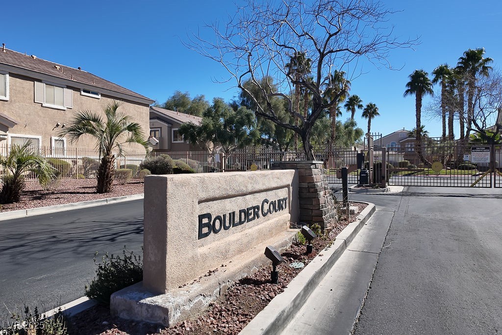 6610 Tumbleweed Ridge Lane, Unit 101 Henderson, NV 89011 - Photo 24 of 24 Community / neighborhood sign featuring a gate and a residential view