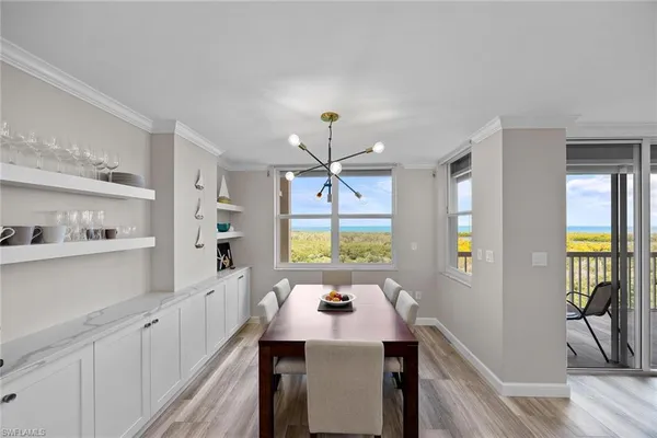 a kitchen with a sink a window and appliances