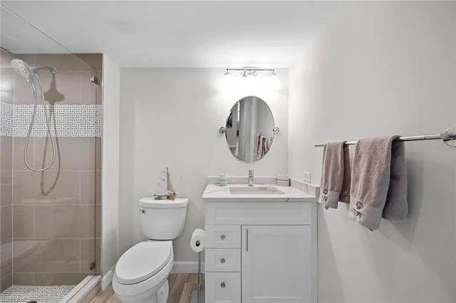 a bathroom with a sink toilet and shower