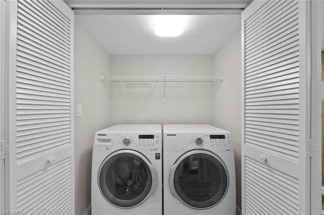 a utility room with dryer and washer
