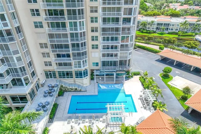 a front view of a residential apartment building with a yard