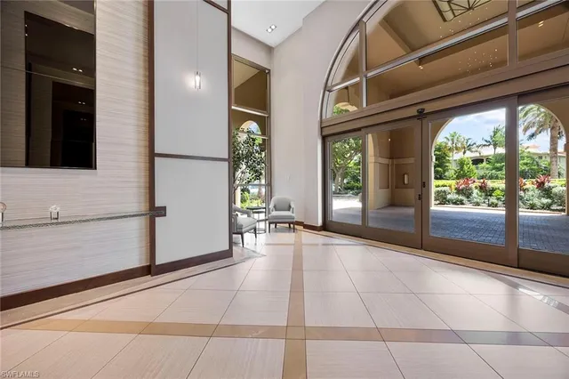 a view of entryway with window and wooden floor