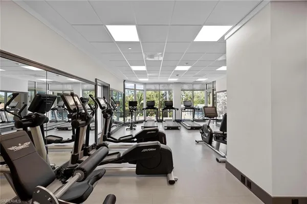 a view of a house with swimming pool and porch with furniture