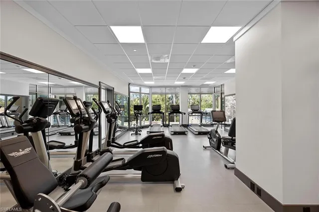 a view of a house with swimming pool and porch with furniture