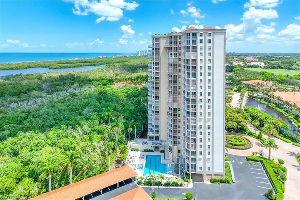 a view of a lake with a building in the background
