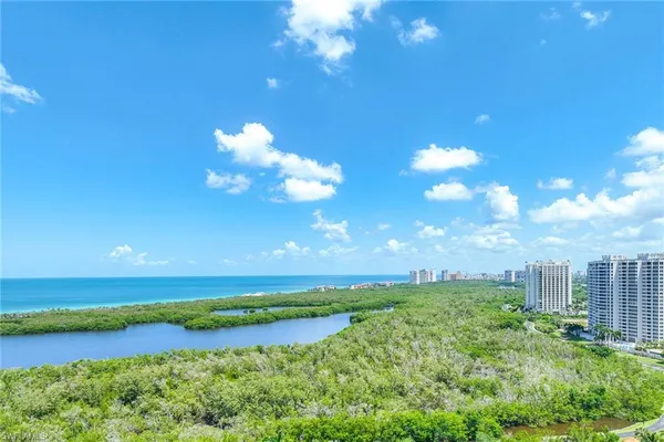 a view of a city with an ocean