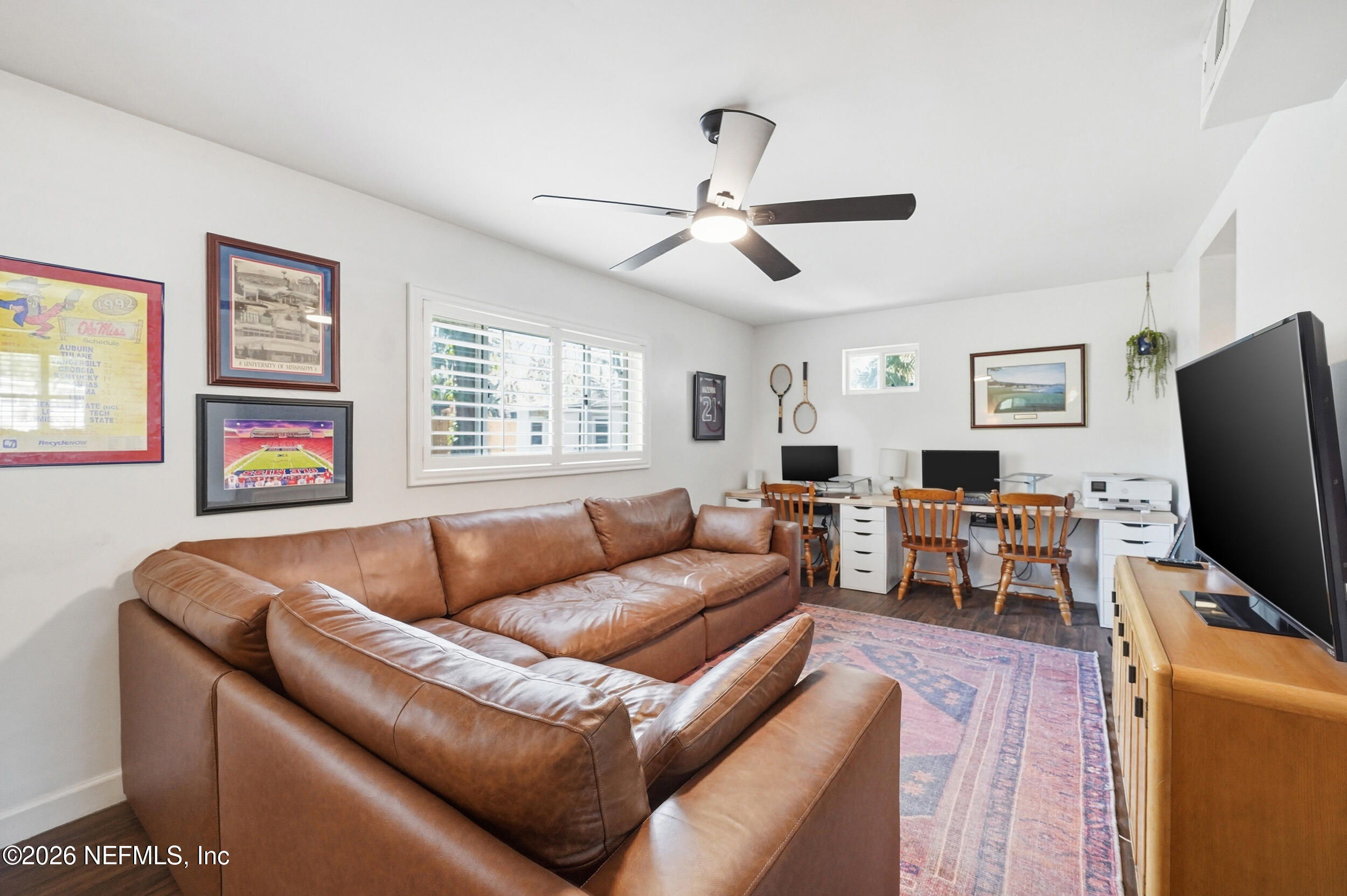 10524 Beverly Nalle Road Jacksonville, FL 32225 - Photo 12 of 28 a living room with furniture and a flat screen tv