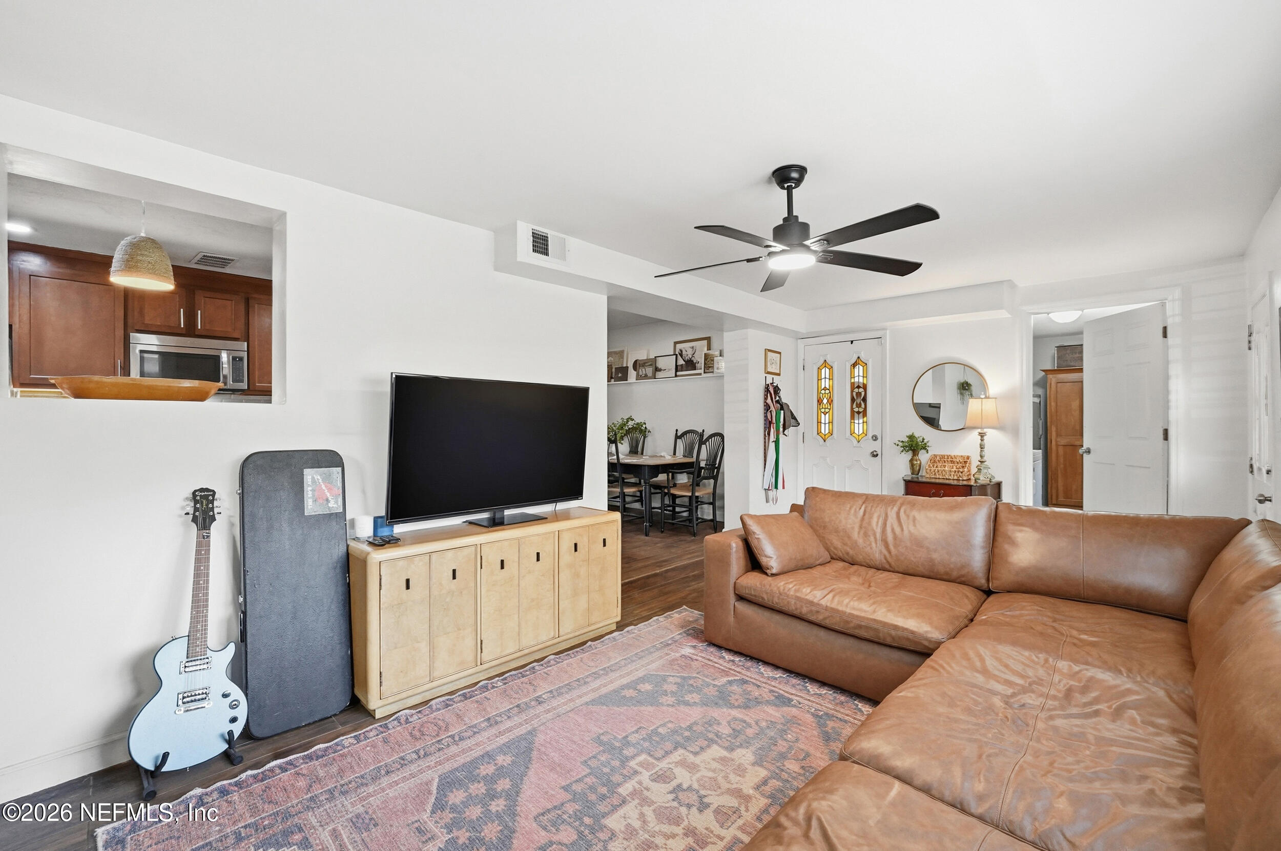 10524 Beverly Nalle Road Jacksonville, FL 32225 - Photo 13 of 28 a living room with furniture and a flat screen tv