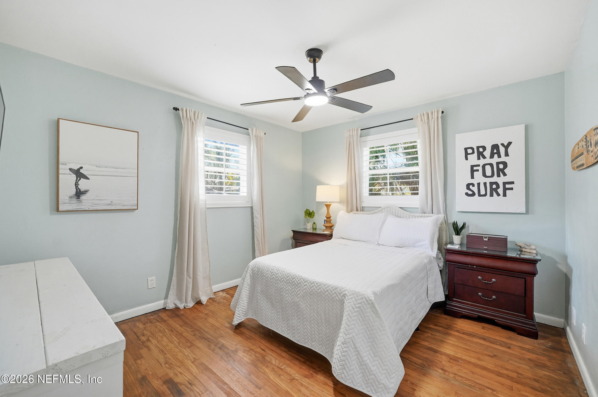 10524 Beverly Nalle Road Jacksonville, FL 32225 - Photo 15 of 28 a bedroom with a bed and wooden floor