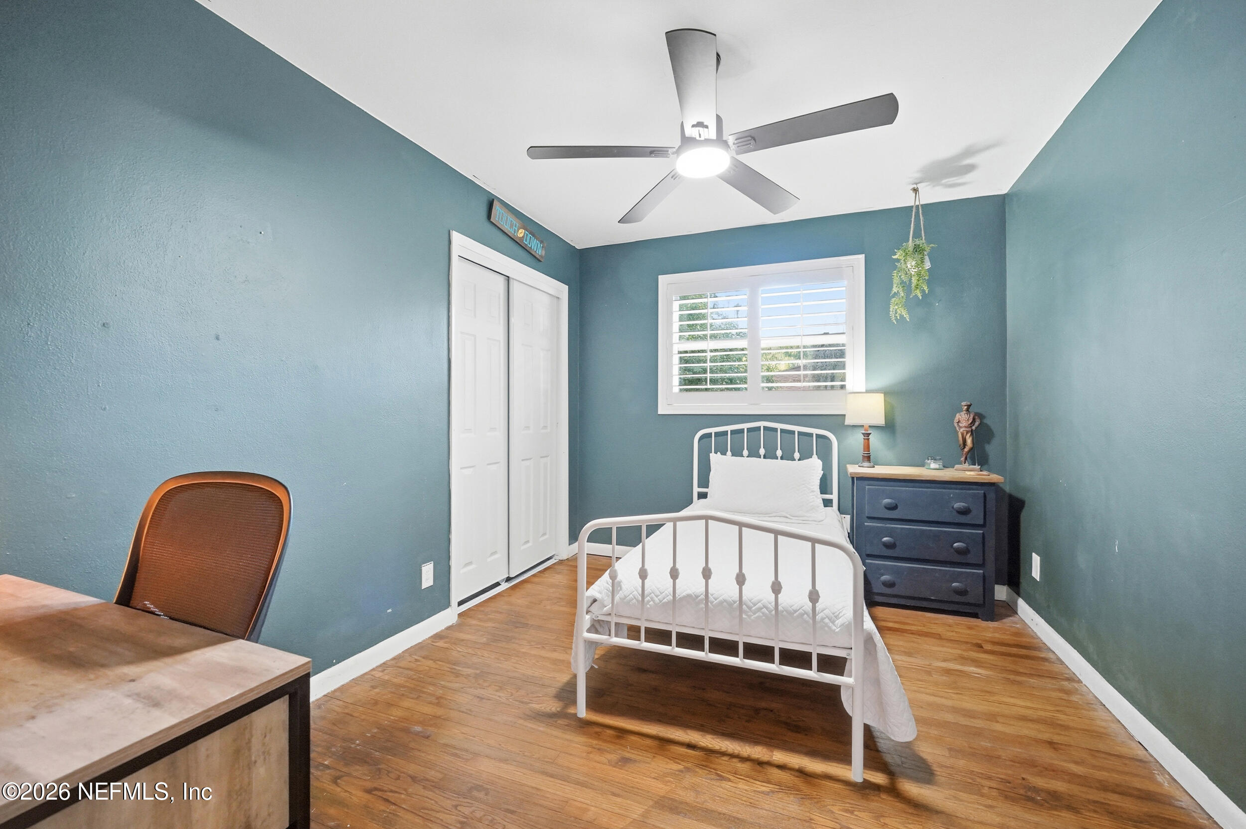 10524 Beverly Nalle Road Jacksonville, FL 32225 - Photo 17 of 28 a bedroom with a bed and a dresser