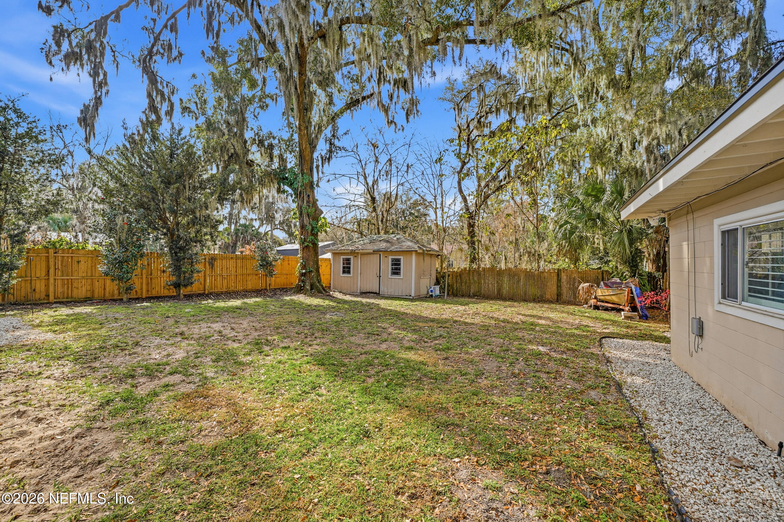 10524 Beverly Nalle Road Jacksonville, FL 32225 - Photo 25 of 28 a front view of a house with a yard and garage
