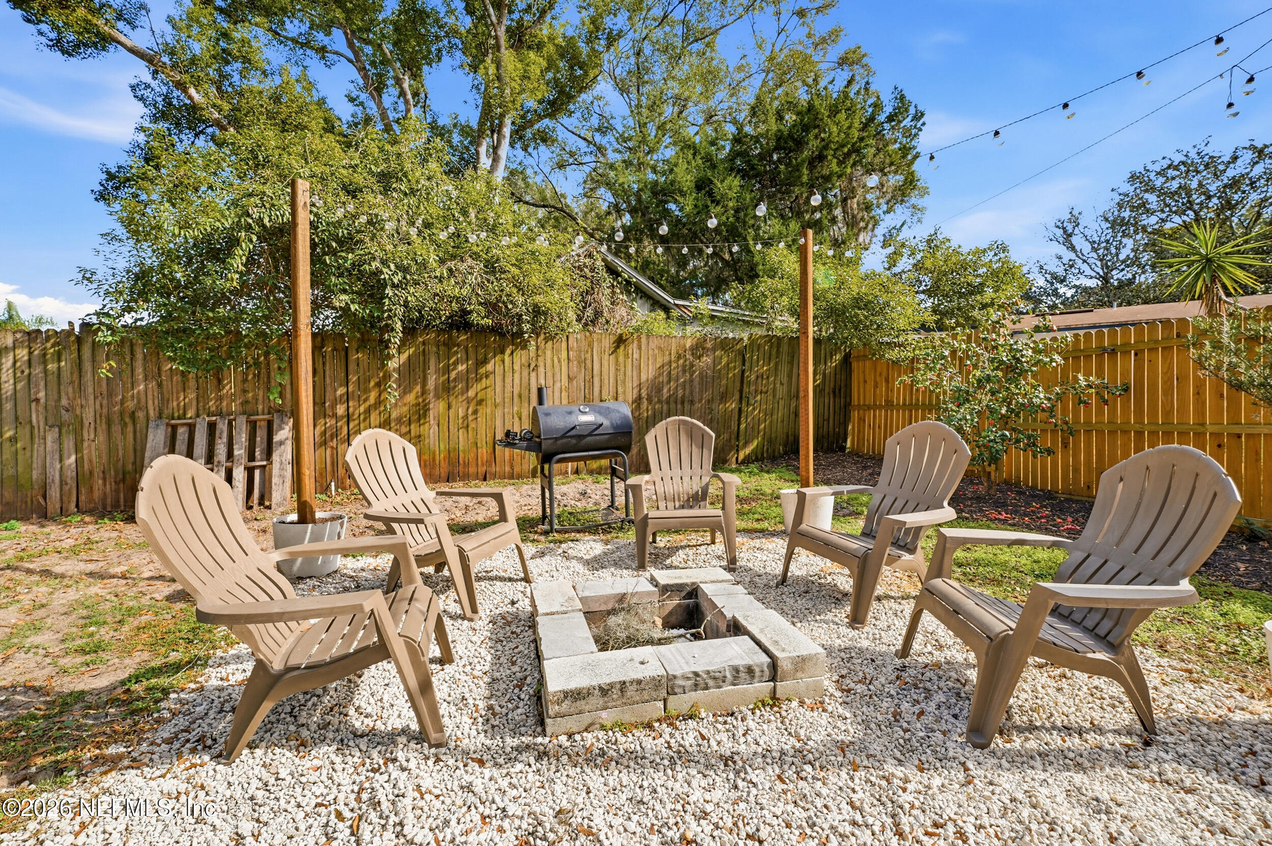 10524 Beverly Nalle Road Jacksonville, FL 32225 - Photo 27 of 28 a view of a chairs and table in patio