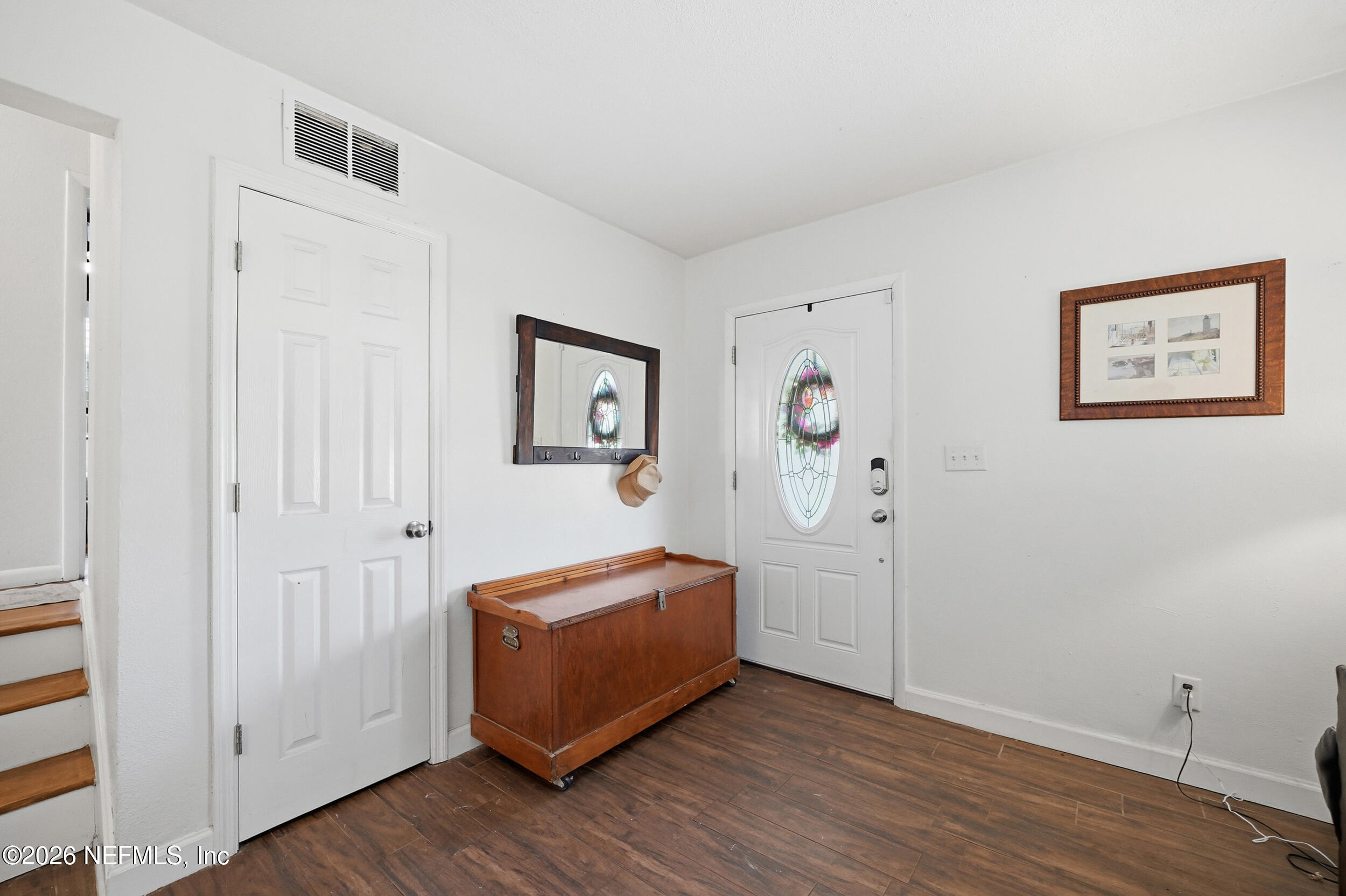 10524 Beverly Nalle Road Jacksonville, FL 32225 - Photo 4 of 28 a view of a livingroom with wooden floor and closet
