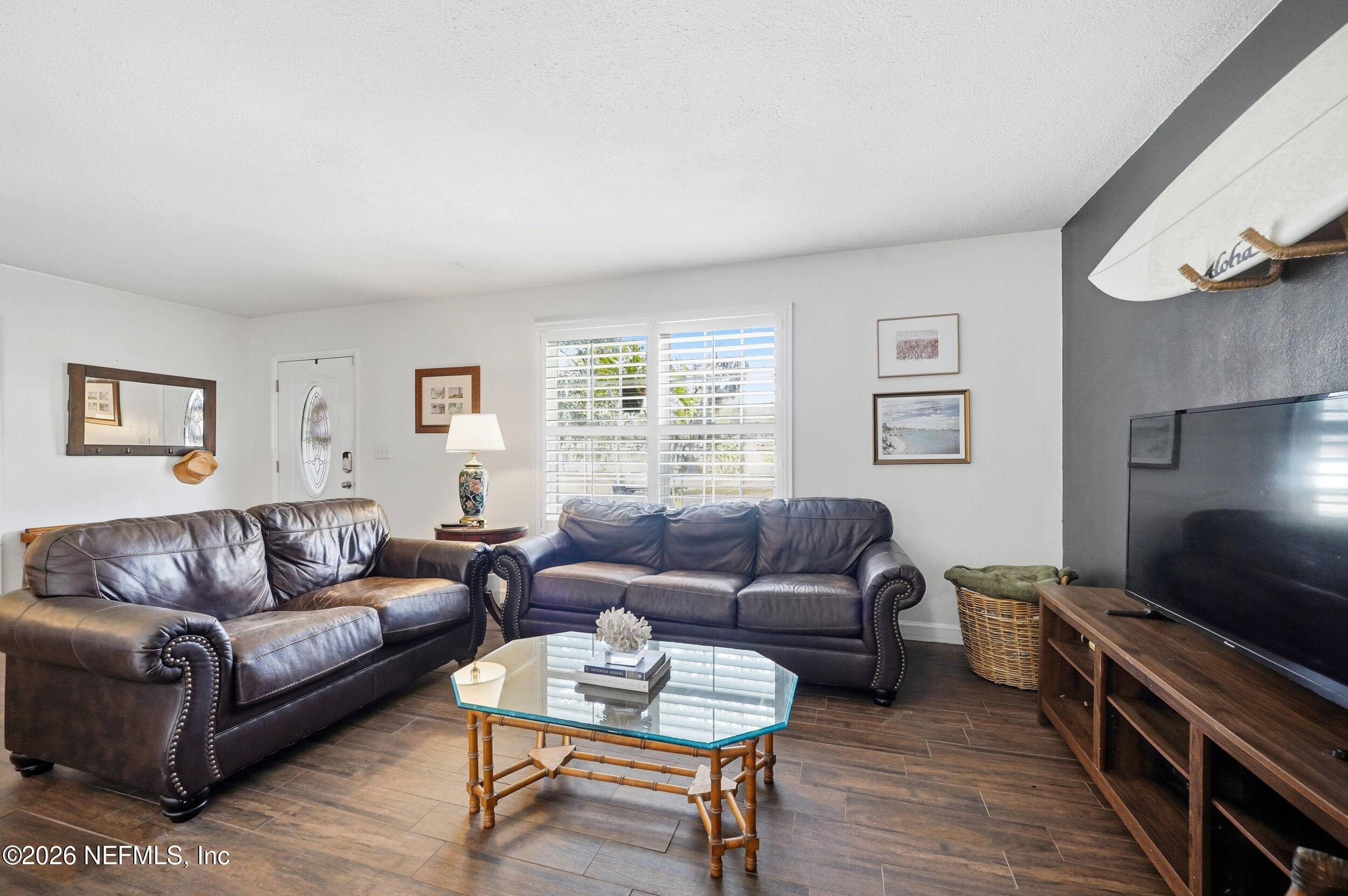 10524 Beverly Nalle Road Jacksonville, FL 32225 - Photo 5 of 28 a living room with furniture and a flat screen tv