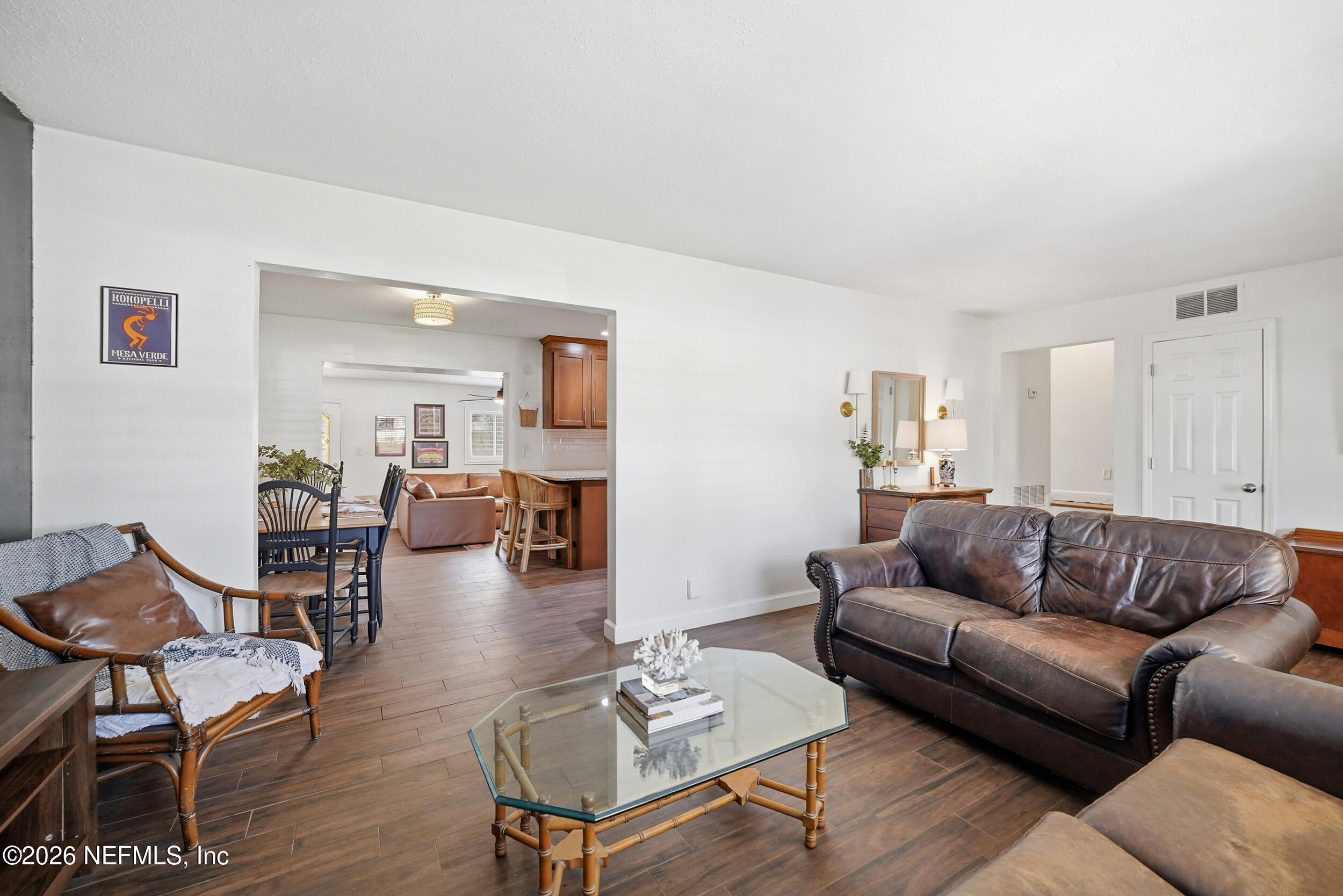 10524 Beverly Nalle Road Jacksonville, FL 32225 - Photo 6 of 28 a living room with furniture or couch and a dining table